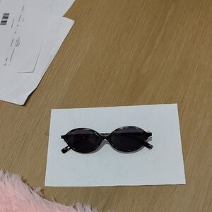 Women’s Oval Tortoiseshell Sunglasses with Dark Lenses